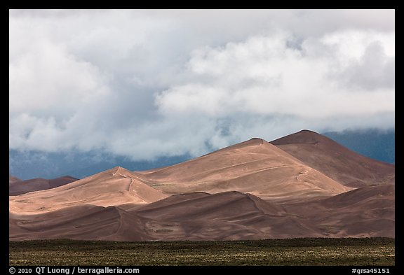 Tall dunes and low clouds. Great Sand Dunes National Park, Colorado, USA.