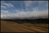 Dunes and clouds at night. Great Sand Dunes National Park, Colorado, USA. (color)