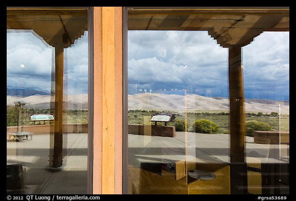 Dune field, visitor center window reflexion. Great Sand Dunes National Park, Colorado, USA.