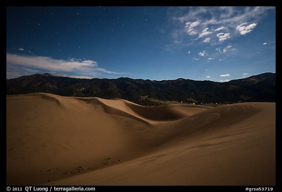 Dunes and mountains at night. Great Sand Dunes National Park and Preserve, Colorado, USA.