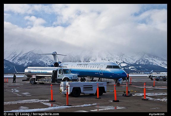 Regional jet and fuel truck, Jackson Hole Airport. Grand Teton National Park, Wyoming, USA.