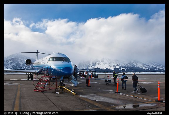 Passengers boarding aircraft, Jackson Hole Airport, winter. Grand Teton National Park, Wyoming, USA.