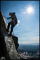 Woman climber rappelling on Grand Teton. Grand Teton National Park ( color)