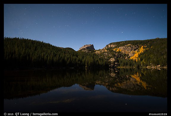 Hallet Peak reflected in Bear Lake at night. Rocky Mountain National Park, Colorado, USA.
