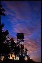 Rankin Ridge tower at dusk and starry sky. Wind Cave National Park, South Dakota, USA. (color)