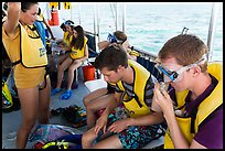 Snorklers getting ready on boat. Biscayne National Park, Florida, USA. (color)