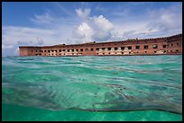 Split view of Fort Jefferson and water with fish. Dry Tortugas National Park, Florida, USA. (color)