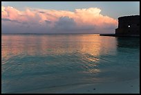 Tropical clouds, beach, and fort at sunrise. Dry Tortugas National Park, Florida, USA. (color)