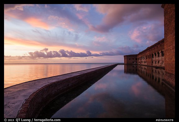 Fort Jefferson seawall, moat and walls at sunset. Dry Tortugas National Park, Florida, USA.