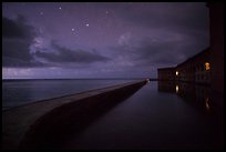 Fort Jefferson at night with stars and light from storm. Dry Tortugas National Park, Florida, USA. (color)