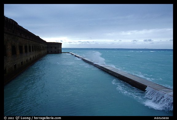 Seawall and moat with waves on stormy day. Dry Tortugas National Park (color)