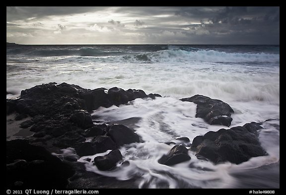 Waves breaking on volcanic rocks. Haleakala National Park, Hawaii, USA.