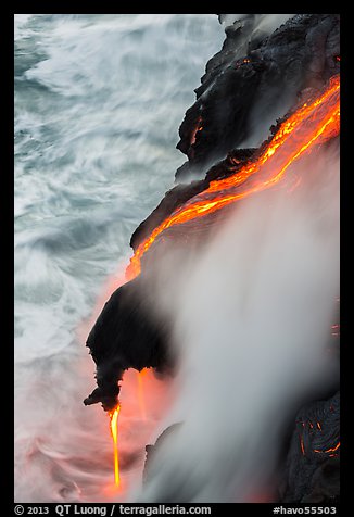 Ribbons of lava flow into the Pacific Ocean. Hawaii Volcanoes National Park, Hawaii, USA.