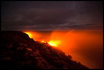 Lava makes contact with ocean on a stary night. Hawaii Volcanoes National Park, Hawaii, USA. (color)