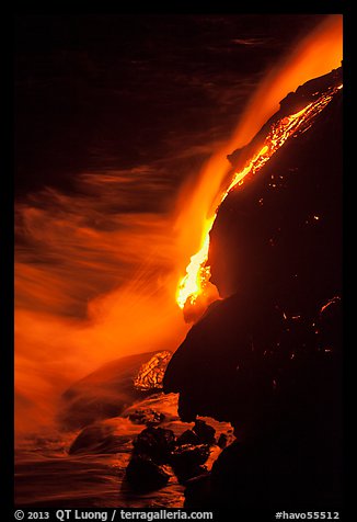 Lava flow entering Pacific Ocean at night. Hawaii Volcanoes National Park, Hawaii, USA.