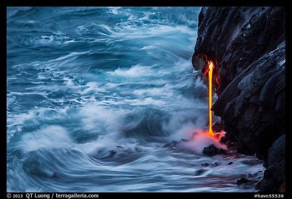 Waves and lava spigot. Hawaii Volcanoes National Park, Hawaii, USA.
