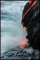 Molten lava drips into the sea. Hawaii Volcanoes National Park, Hawaii, USA. (color)
