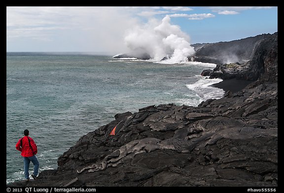 Park visitor looking, lava ocean entry plume. Hawaii Volcanoes National Park, Hawaii, USA.
