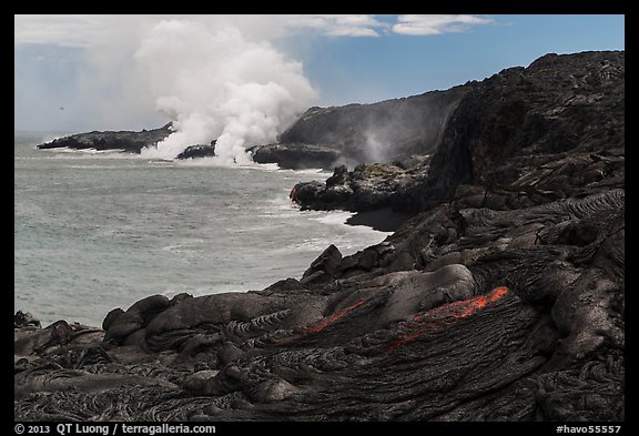 Molten lava flow and ocean plume. Hawaii Volcanoes National Park, Hawaii, USA.