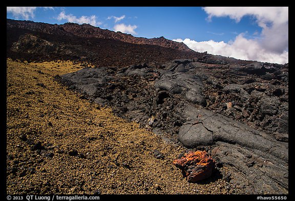Olivine crystals, red lava rock, and lava fields, Mauna Loa. Hawaii Volcanoes National Park, Hawaii, USA.