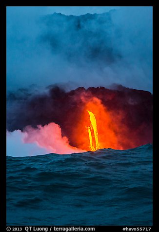 A single spigot of lava creates a large plume steam at sunrise upon reaching ocean. Hawaii Volcanoes National Park (color)