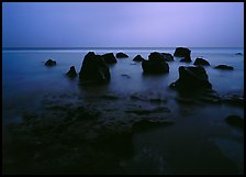Rocks in water at dusk, Siu Point, Tau Island. National Park of American Samoa (color)