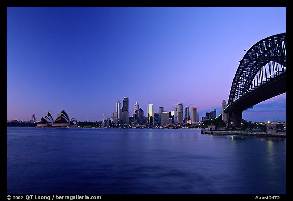 Harbour bridge, city skyline and opera house, dawn. Sydney, New South Wales, Australia
