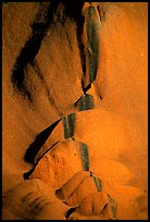 Rock sculptured by flash flood flows on Ayers Rock. Uluru-Kata Tjuta National Park, Northern Territories, Australia (color)