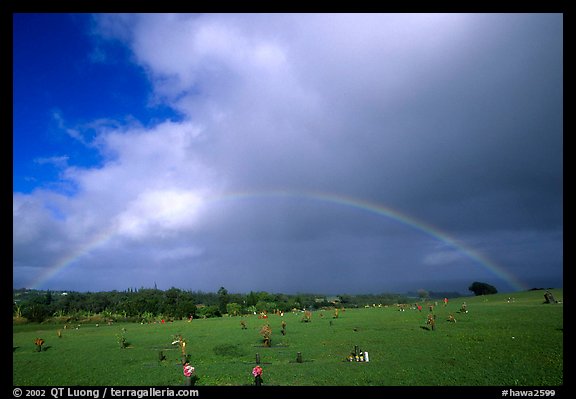 Rainbow over grassy cemetery. Maui, Hawaii, USA