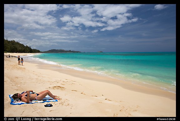Woman sunning herself on Waimanalo Beach. Oahu island, Hawaii, USA (color)