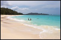 Couple and other bathers in the water, Waimanalo Beach. Oahu island, Hawaii, USA ( color)