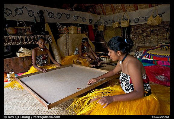 Fiji women playing at a traditional pool table in vale ni bose house. Polynesian Cultural Center, Oahu island, Hawaii, USA (color)