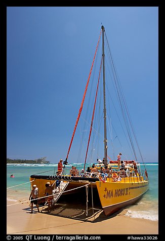 Catamaran landing on Waikiki Beach. Waikiki, Honolulu, Oahu island, Hawaii, USA (color)