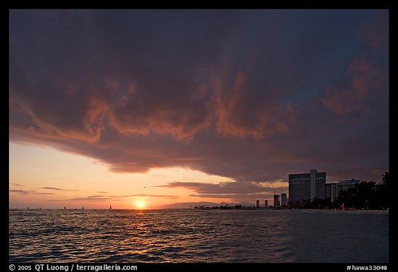 Sun setting and Honolulu skyline. Waikiki, Honolulu, Oahu island, Hawaii, USA (color)
