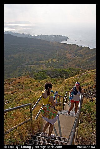 Tourists take a photo on the last steps of the Diamond Head crater summit trail. Oahu island, Hawaii, USA