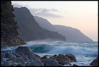 Boulders, waves, and Na Pali Coast, sunset. North shore, Kauai island, Hawaii, USA (color)