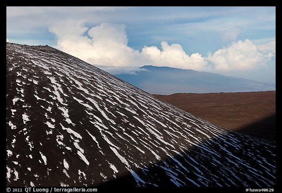 Cinder cone with snow stripes, distant clouds. Mauna Kea, Big Island, Hawaii, USA (color)