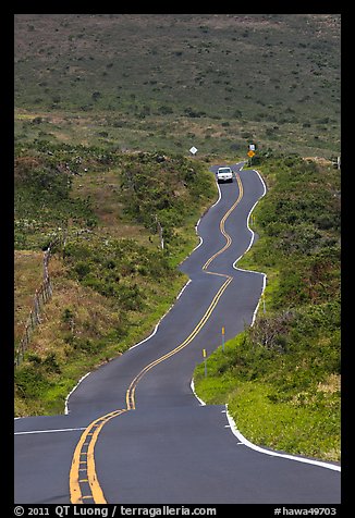 Car on winding Pilani Highway. Maui, Hawaii, USA