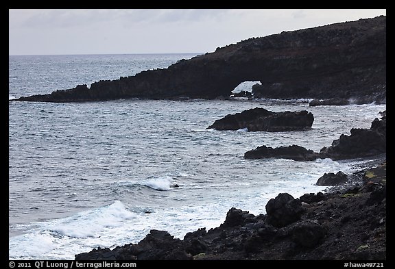 Dark coastline with sea tunnel. Maui, Hawaii, USA (color)