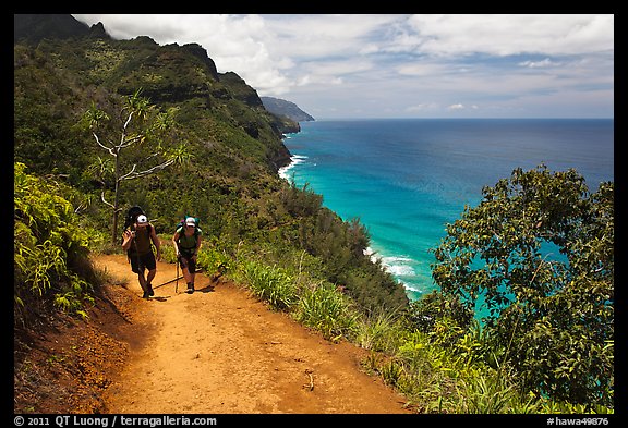 Hikers on Kalalau trail, Na Pali coast. Kauai island, Hawaii, USA (color)