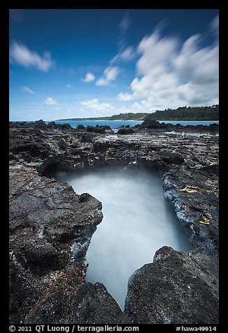 Surf in blowhole, Mokolea lava shelf. Kauai island, Hawaii, USA