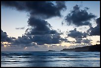 Clouds at sunrise over Kalihiwai Bay. Kauai island, Hawaii, USA