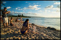 Visitors view sea turtles on Laniakea Beach. Oahu island, Hawaii, USA ( color)
