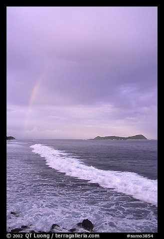 Rainbow at sunset, wave, and Aunuu island. Aunuu Island, American Samoa