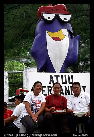 Women in front of statue of Charlie the Tuna. Pago Pago, Tutuila, American Samoa