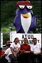 Women in front of statue of Charlie the Tuna. Pago Pago, Tutuila, American Samoa (color)