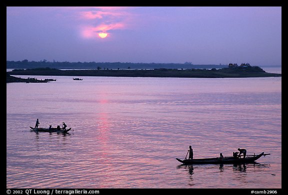 Boats at sunrise, Tonle Sap river,  Phnom Phen. Cambodia