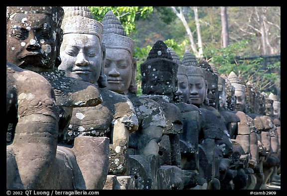 Statues near the gates of the temple complex. Angkor, Cambodia (color)