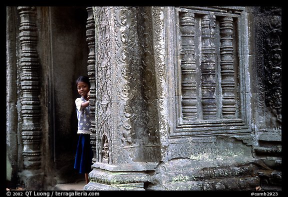 Girl hides in Ta Prom. Angkor, Cambodia (color)