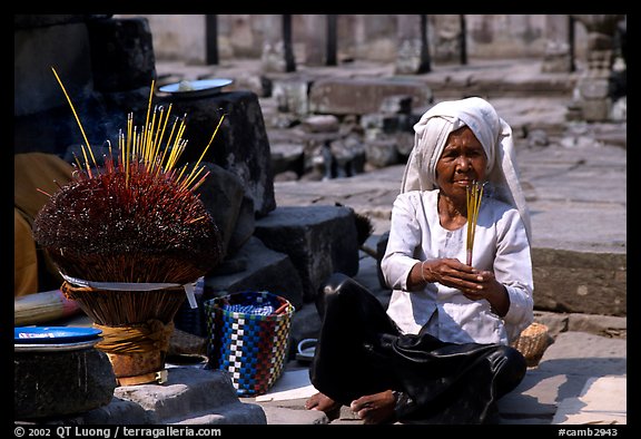 Incence vendor wearing traditional headcloth. Angkor, Cambodia